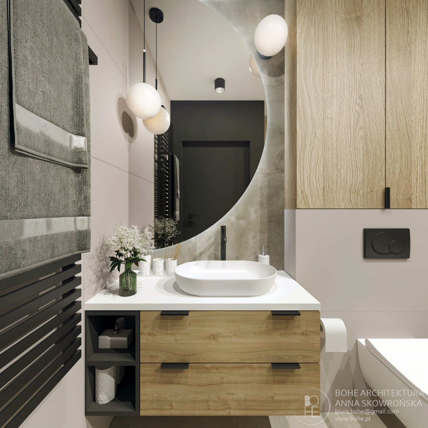 duże lustro w łazięce docięte koło drewniane fronty duży czarny grzejnik na ręczniki